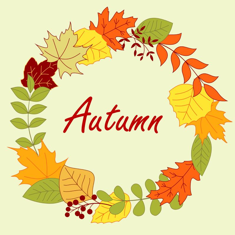 wreath made of autumnal leaves with the word autumn written in red text in the center