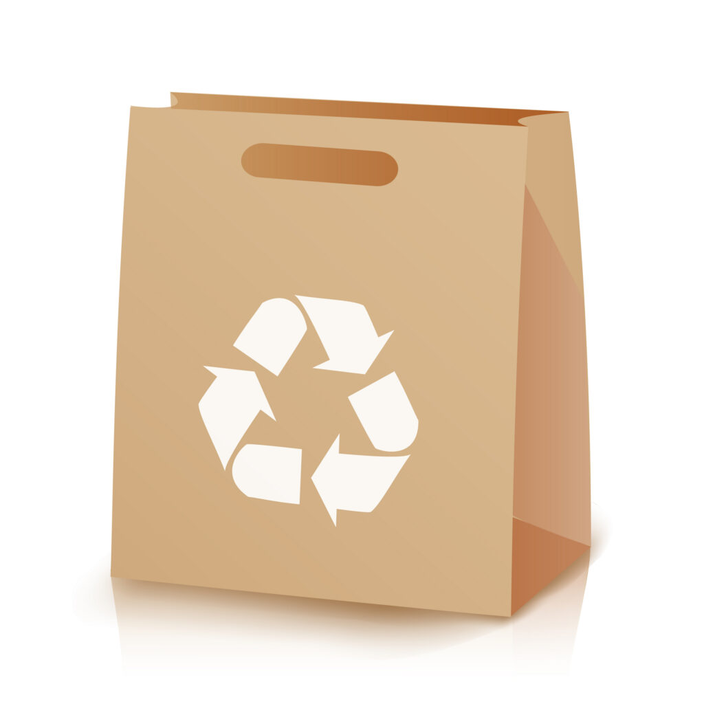 vector image of a brown recycled paper bag with recycle symbol icon on front